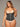 Plus size model wearing a semi vest latex waist trainer with underwear.